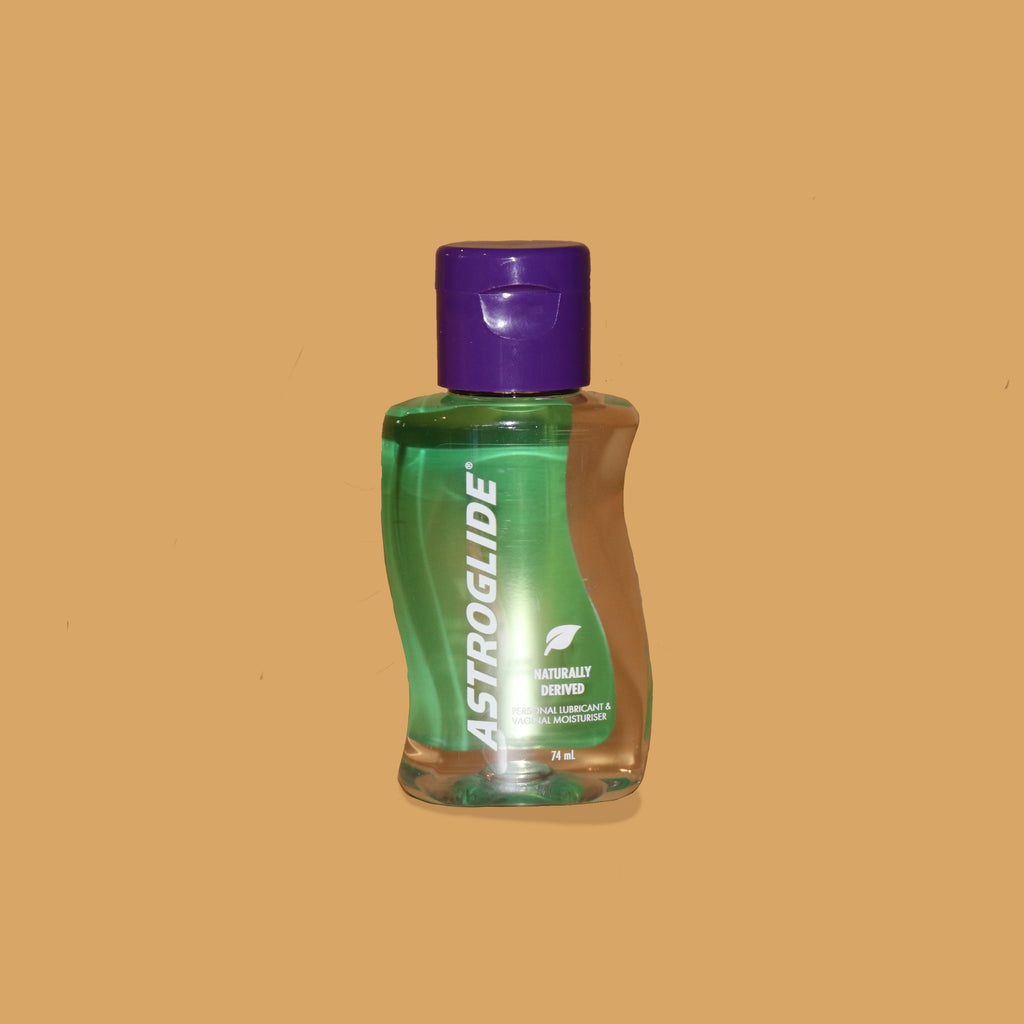 The astroglide natural lubricant on orange background. It has a purple cap on top. Accessible accessories and products XES Products 