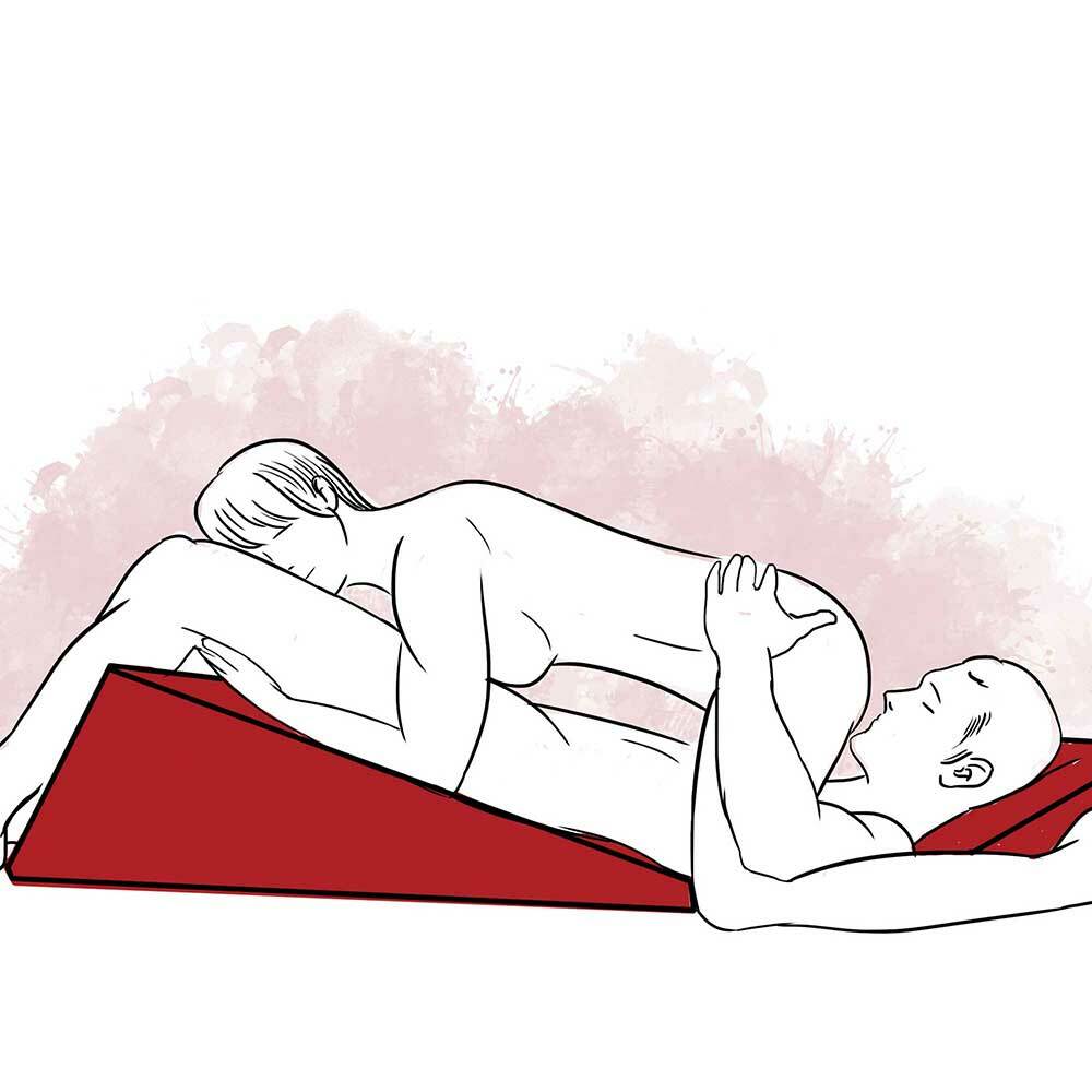 Illustration of one partner lying with his back on the ramp, while his head is propped on the wedge. The other partner is lying on top of her partner with her forearms resting on the ramp. 