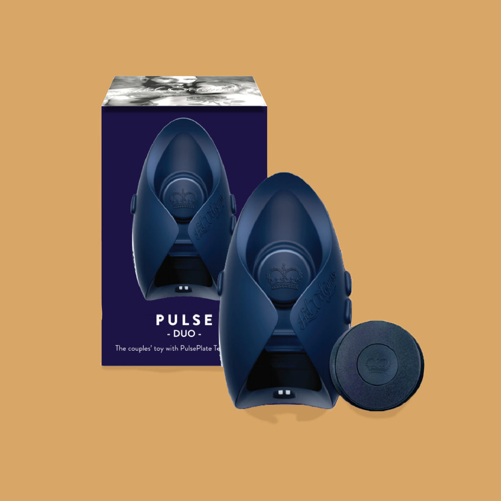 The hot octopuss pulse duo. The guybrator is black and can curve around the penis with two wings. The guybrater is slightly higher at the end. There is a plus and minus button on the side of the vibrator to change the vibration. The packaging is in the background