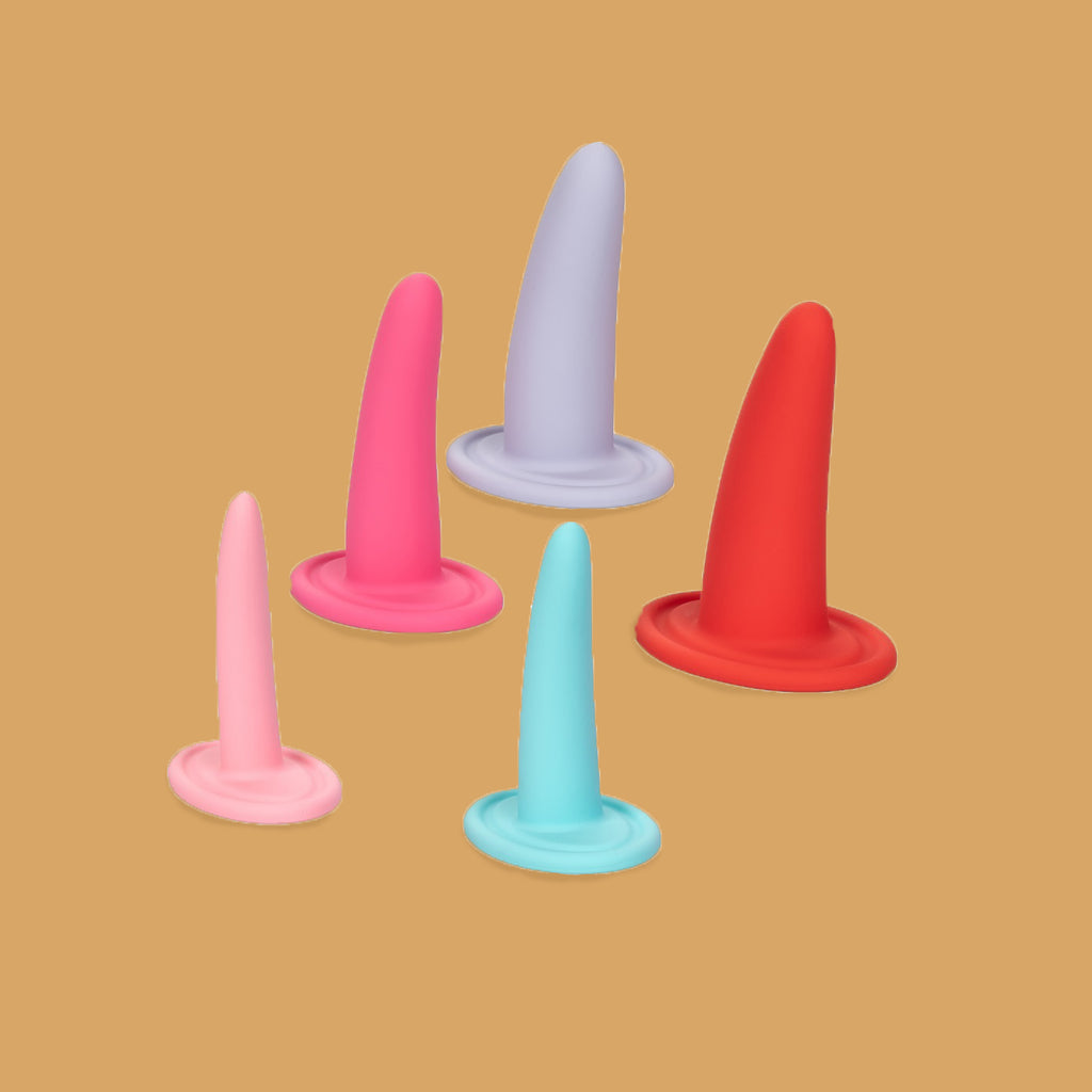 The She-Ology Dilator set by Calexotics. Orange background with the 5 dilators shown. The dilators gradually get bigger in size. Moving from smallest to largest the colours areL light pink, baby blue, hot pink, red and lavender. 